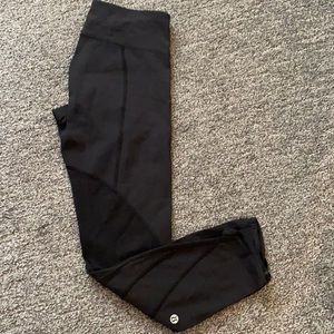 Lululemon. Mid rise. Black luxtreme with mesh detailing on the side.